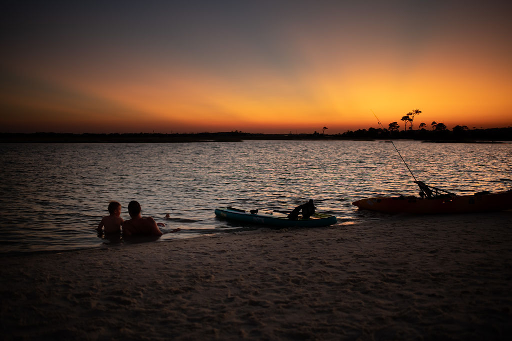 Family on beach at sunset in Destin Florida